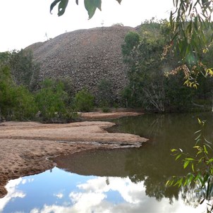 Piles of rock and contaminated water - old mining legacy.