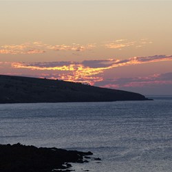 Setting sun over Christmas Cove - Penneshaw