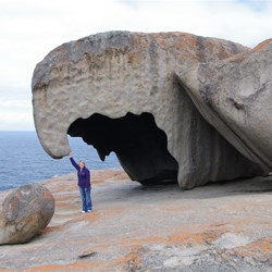 Fiona holding the rock up with 1 arm