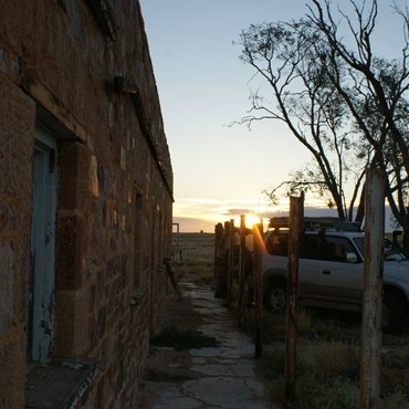 Sunset at Anna Creek - Johnno setting up.
