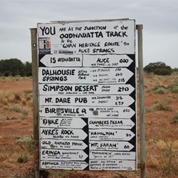 One of the many signs created to assist travellers by the Pink Roadhouse