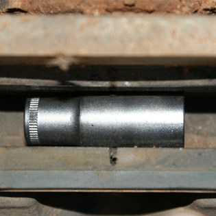 12mm socket wedged between brake pads - An old trick for a new player