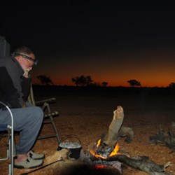 camp fire scene after dark