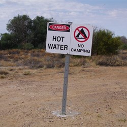Take notice of this sign, pets have died from jumping into the pond