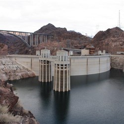 View over back of Hoover Dam, bridge in background