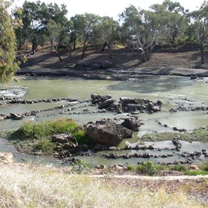 Stones forming fish traps in the river