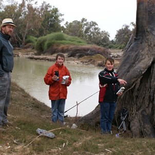 Some damp men fishing by the Cooper