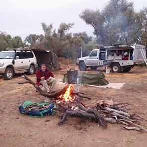 Enjoying the fire during a momentary lull in the rain - Cooper Creek