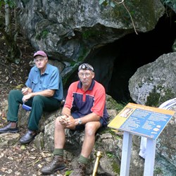 The boys look thrilled about going into the cave