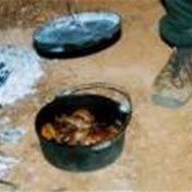 Roast lamb in camp oven with potatoes 