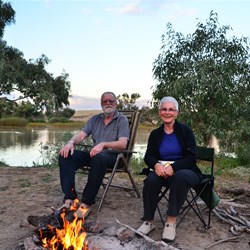 silly photo sitting at the campfire