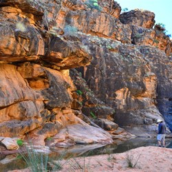 at the end of the gorge....red rocks, water and sandy beach