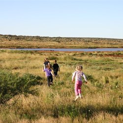 Kids running to the Lyndon River