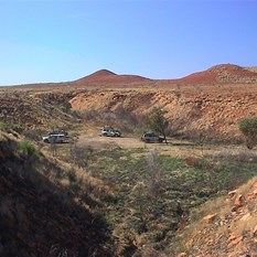 Views of vehicles at camp in Breaden Valley 