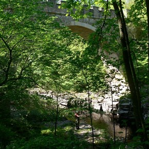 Fisherman trying his luck under a bridge, River Tees