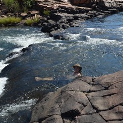 Darren relaxing in the rock pools and waterfalls at Mitchell Falls