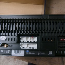 This is the rear of the unit, with built in fuse. The white units are the wiring plugs, to the left is the radio aerial and the gps plugs.