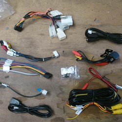 These are the wiring harness's. They were pretty self explanitary. The top one is a Toyota harness with big white plug in's. I threw this in the bin.