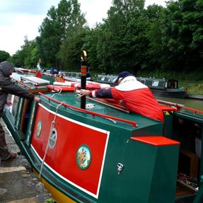 Our boat for the cruise and her volunteer crew hard at work