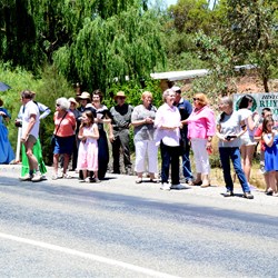 Rhynie locals gather to greet the approaching party