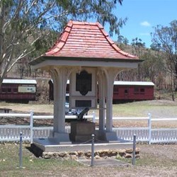 Linville War Memorial - Restored rollingstock in background