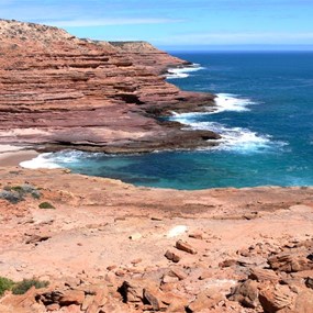 Red cliffs continue south