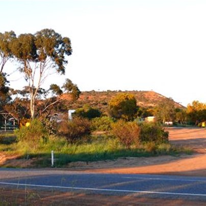 Roadside camp with blacked out sign