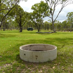 The camping area had several concrete fire pits