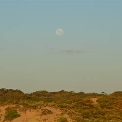 The rising moon before the sun sets