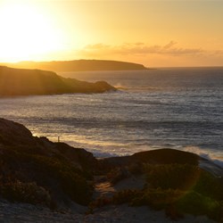 The setting sun over Browns Beach