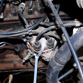 Broken distributor cap held together with araldite and cable ties