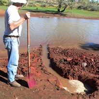 Trying unsuccesfully to dig out somewhere to fill a bucket