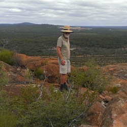 at the top John stands enjoying the views
