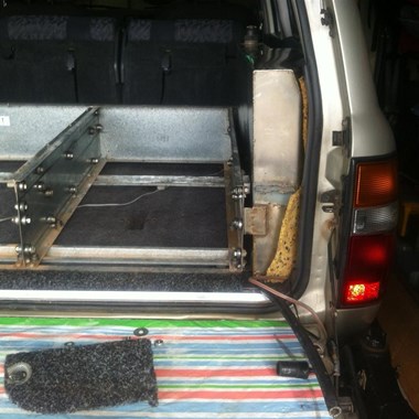 Custom water tank fits next to drawers