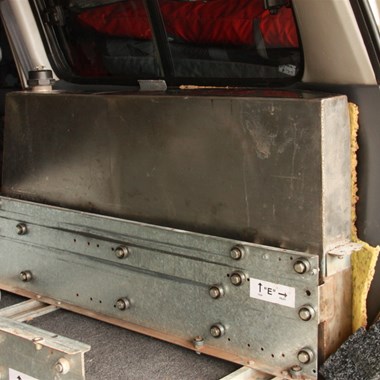 Closer view of water tank & drawer system