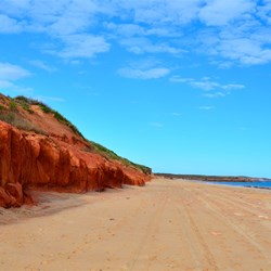 red cliffs and white sand