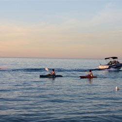 Michelle waterskiing at sunset