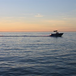 Michelle waterskiing at sunset