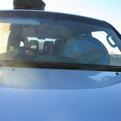 Shelley holding our spare wheel on her lap!