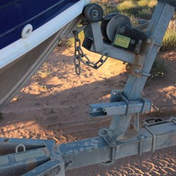 Trailer without its spare wheel mounted on the drawbar