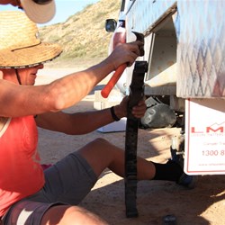 David fixing Justin's trailer suspension