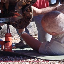 Andrew working on the repairs to my car