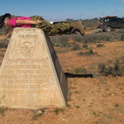 Planking on an atomic bomb obelisk