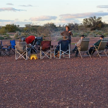 Group chairs set up around the fire