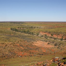 The creek snaking its way across the plain to the east