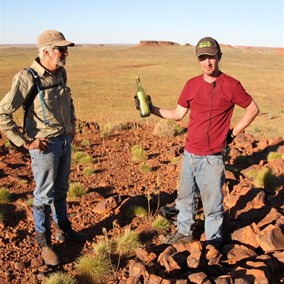 Alan and Jaydub with the bottle and cairn - Mt Wilson