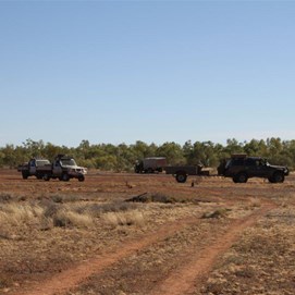 Vehicles at bronco - Note Durbai Creek treeline in background