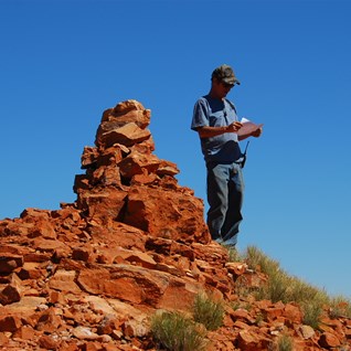 Alan 'reckoning' the surrounding countryside against Carnegie's drawings