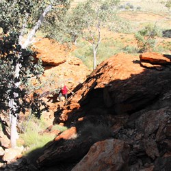 Suze clambering into the gully of jumbled boulders