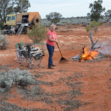 Fiona cleaning up around our campfire